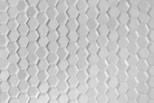Gray Hexagon Background wall Texture. wall background. background texture. wall with textured hexagons. the diamonds on the wall. white wall © Viacheslav