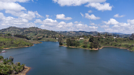 Fototapeta na wymiar Panoramic dam of the Peñol - Guatape in the department of Antioquia Colombia, day of blue and sunny nines