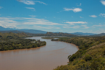 Obraz premium river in the mountains with blue sky