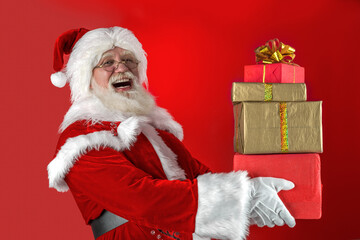 Emotional senior male model old man with a natural white beard in the role of Father Christmas