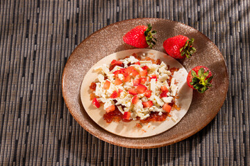 Traditional Colombian dessert - Wafers with fruit, cheese and caramel sauce