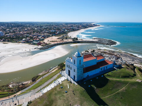Aerial view of Saquarema and Ita&uacute;na beach in Rio de Janeiro. Famous for the waves and the church on top of the hill. Sunny day. drone photo.
