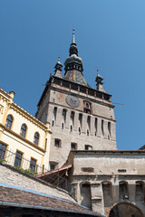 Fototapeta na wymiar View of famous medieval fortified city and the Clock Tower, Sighisoara, Romania.