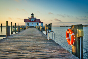 A morning view of the Roanoke Marshes Lighthouse along the ocean pier in Manteo, North Carolina