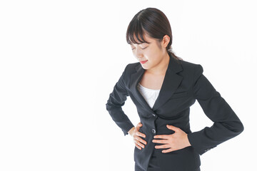 腹痛に苦しむ若いビジネスウーマン