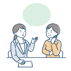 窓口で相談をしている中年の女性