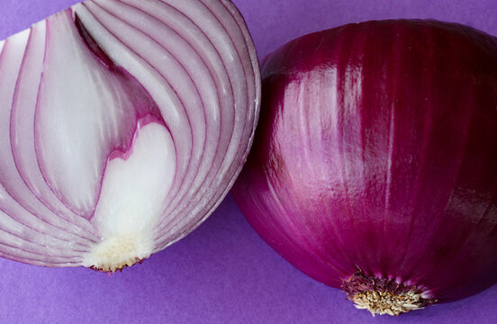 Fresh cut purple onion closeup, showing the rich color, beauty of this spicy cooking ingredient. 