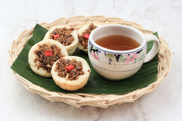 Kue Talam Oncom, Traditional Steamed Cup Cake from Indonesia with Oncom Topping. Oncom is One Traditional Staple Foods of West Java Made from Soy Bean or Peanut Fermentation. 