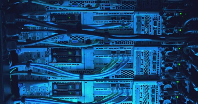 Close-up view of modern internet network switch with plugged ethernet cables. Blinking green lights on internet server. Optical server. Commutator. Flashing lights. Optical fiber. Video IP Gateways.