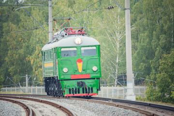 Freight retro electric locomotive at cloudy day.