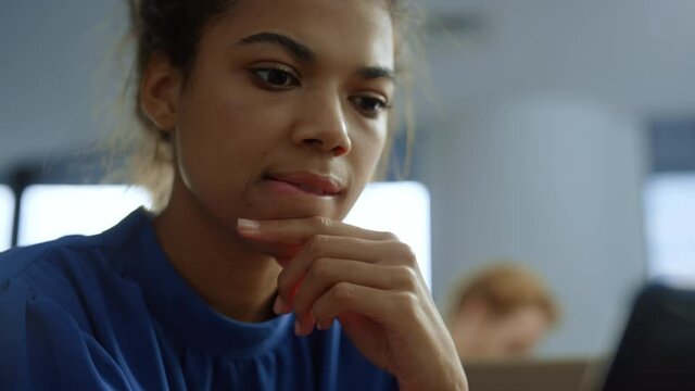 Businesswoman looking at smartphone screen. Woman with thinking face 