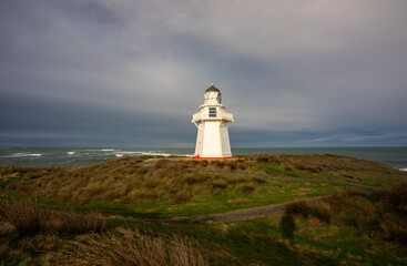 Fototapeta na wymiar Waipapa lighthouse in the Catlins New Zealand with stormy clouds
