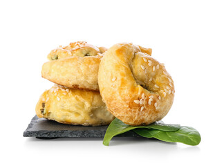 Puff pastry stuffed with spinach on white background