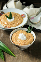 Red and White Porridge (Bubur Merah Putih or Jenang Sengkolo) is a Dish for Welcome the Birth of a Baby in the Javanese. Made from Rice, Sugar, Coconut Milk, Pandan Leaves, and Salt.