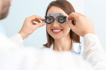 Young woman visiting ophthalmologist in clinic