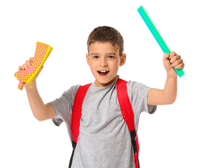 Little schoolboy with pencil case and ruler on white background