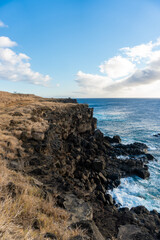 Fototapeta na wymiar Black rock cliffs overlooking the ocean