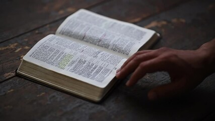 Man reading a bible - Powered by Adobe