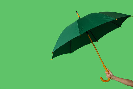 Female Hand With Open Umbrella On Color Background