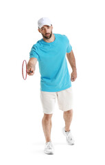 Sporty male badminton player on white background