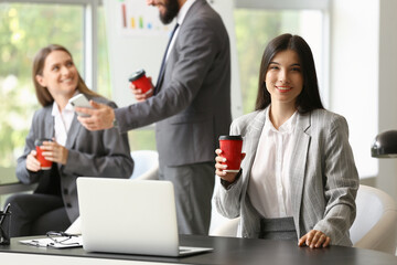 Business people having coffee break in office