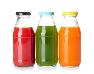 Bottles with healthy juice on white background
