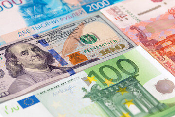 dollars, rubles and euros. close-up of new bills