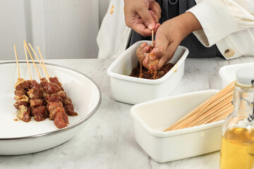 Preparing Homemade Lamb Satay (Sate Kambing) for Idul Adha Menu. Sate Kambing is Popular Street Food in Indonesia.