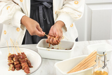 Preparing Homemade Lamb Satay (Sate Kambing) for Idul Adha Menu. Sate Kambing is Popular Street Food in Indonesia.