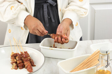 Preparing Homemade Lamb Satay (Sate Kambing) for Idul Adha Menu. Sate Kambing is Popular Street Food in Indonesia.