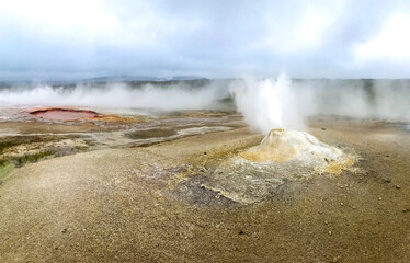 Geyser steams in the geothermal volcanic desert zone Hveravellir. Iceland