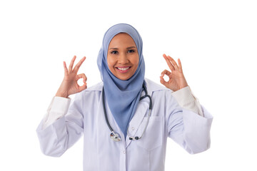 medicine, healthcare, charity and people concept - close up portrait of smiling muslim female doctor wearing white coat and showing ok sign with two arms, isolated over white background