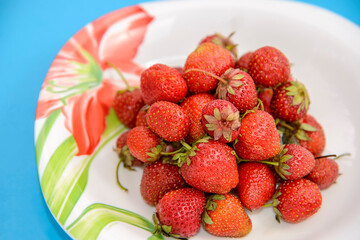 Juicy strawberries on a plate