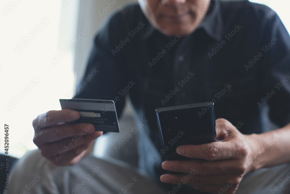 Poster man using credit card and mobile phone for online shopping and internet payment via mobile banking a