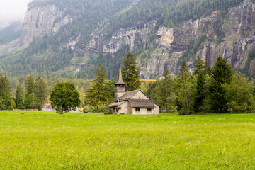 The Church of Our Lady (Marienkirche) with wood shingle roof on the sommer meadow of Kandersteg, Bern, Switzerland