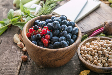 Blank notepad for copy space and  food ingredients on wooden table
