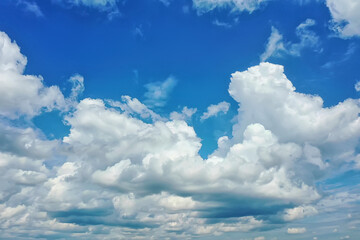 white clouds on blue sky background, abstract seasonal wallpaper, sunny day atmosphere