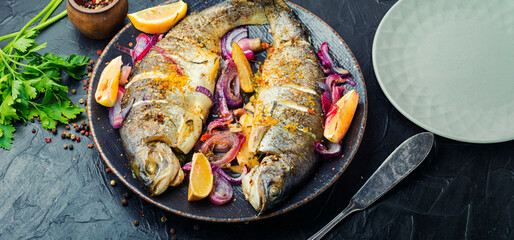 Whole baked rainbow trout.