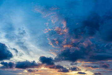 Fototapeta na wymiar Dramatic sunset sky with beautiful color sun light and cloudy sky.