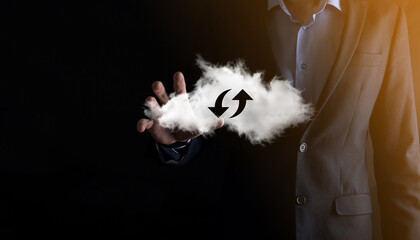 Cloud technology. Polygonal wireframe cloud storage sign with two arrows up and down on dark ....