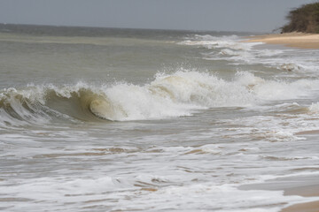 Arabian Ocean waves with foam of blue and turquoise color. Sea foam creating amazing shapes and patterns like glacier. Abstract Arabian Ocean blue water with white wave for background.
