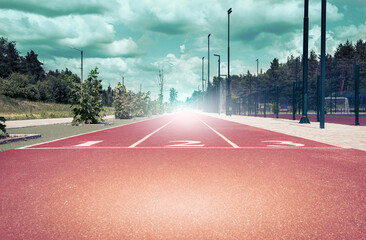 Athletic track with three positions, toned with a retro vintage filter. Concept for business, motivation, start.