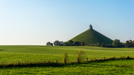A common autumn day at the Lion's Mound (Butte du Lion) memorial site, a monument to the casualties of the 1815 Battle of Waterloo in Wallonia, Belgium - obrazy, fototapety, plakaty