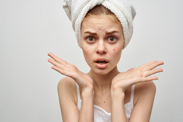 beautiful woman with a towel on my head hygiene treatment