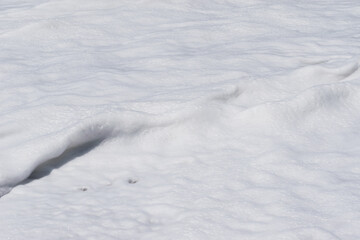 Arabian Ocean waves with foam of blue and turquoise color. Sea foam creating amazing shapes and patterns like glacier. Abstract Arabian Ocean blue water with white wave for background.