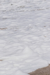 Arabian Ocean waves with foam of blue and turquoise color. Sea foam creating amazing shapes and patterns like glacier. Abstract Arabian Ocean blue water with white wave for background.