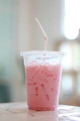 Close-up beverage of strawberry milk for Summer put on the table. 