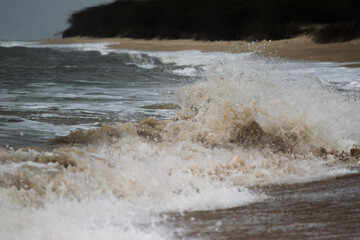 Arabian Ocean waves with foam of blue and turquoise color. Sea foam creating amazing shapes and patterns like glacier. Abstract Arabian Ocean blue water with white wave for background.