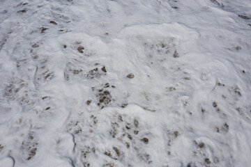 Arabian Ocean waves with foam of blue and turquoise color. Sea foam creating amazing shapes and patterns like glacier. Abstract Arabian Ocean blue water with white wave for background.