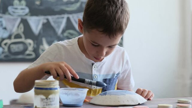 workshop for kids. Children learning how to use clay for making beautiful dishes. Workshop, master class.